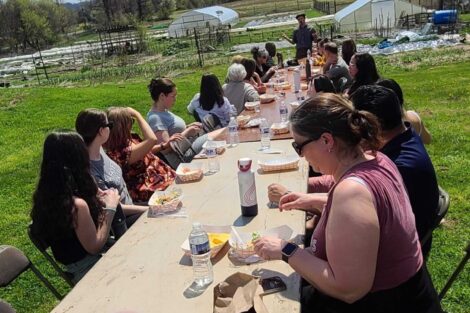 Lafayette Staff enjoying lunch outdoors at LaFarm